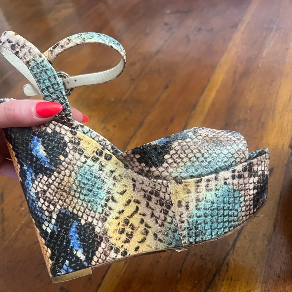 Alice and Olivia snakeskin platform heels.